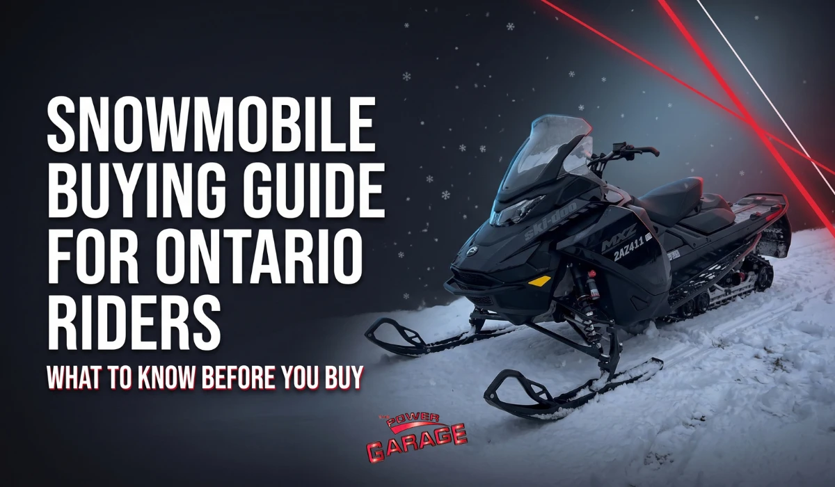 Black snowmobile parked on a snowy trail at night with Snowmobile Buying Guide for Ontario Riders headline and The Power Garage logo